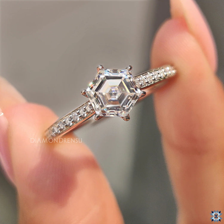 White gold ring with a unique hexagon engagement ring and round cut pave setting.