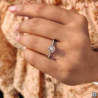 6 claw prong setting ring in white gold featuring a hexagon design.