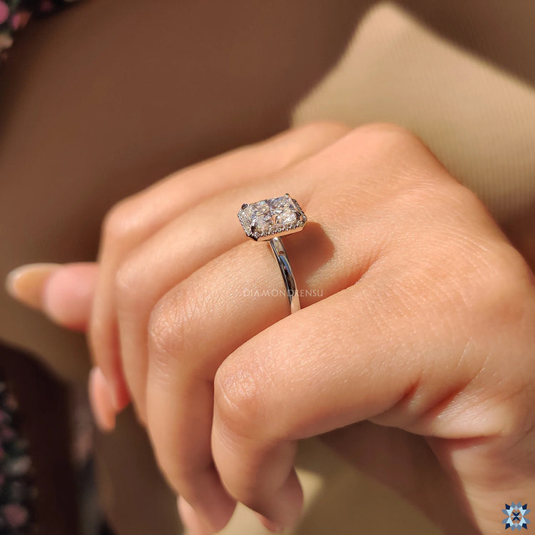 Unique engagement ring designed with radiant cut diamond and artistic details