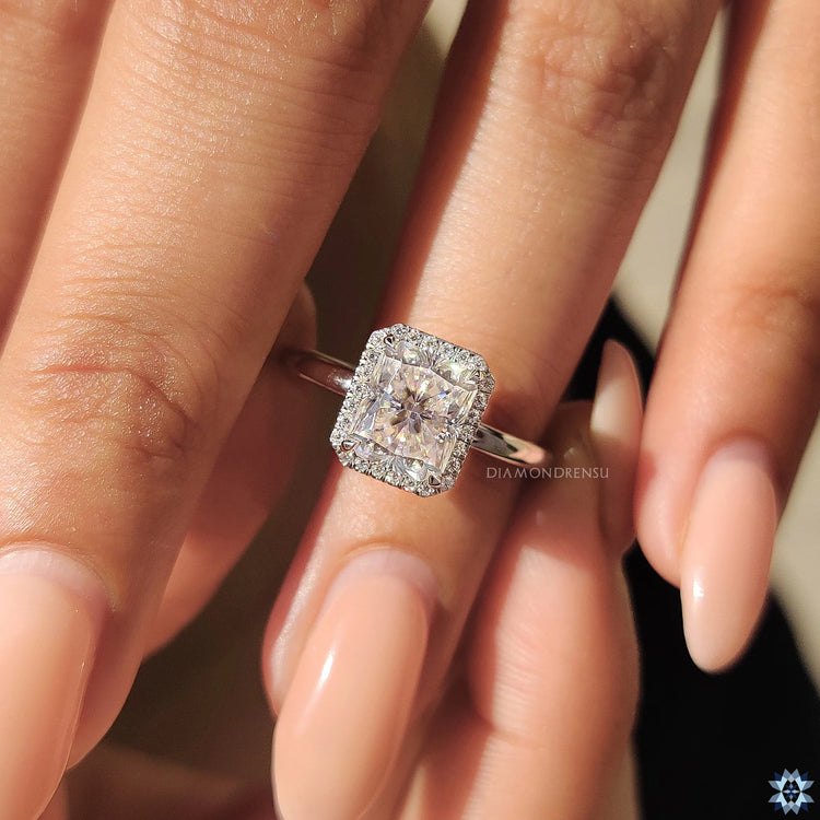 Handmade ring crafted with a radiant cut stone in a claw prong setting