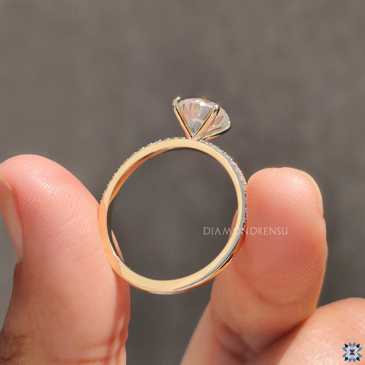 Round pave engagement ring with handcrafted details and a secure prong setting