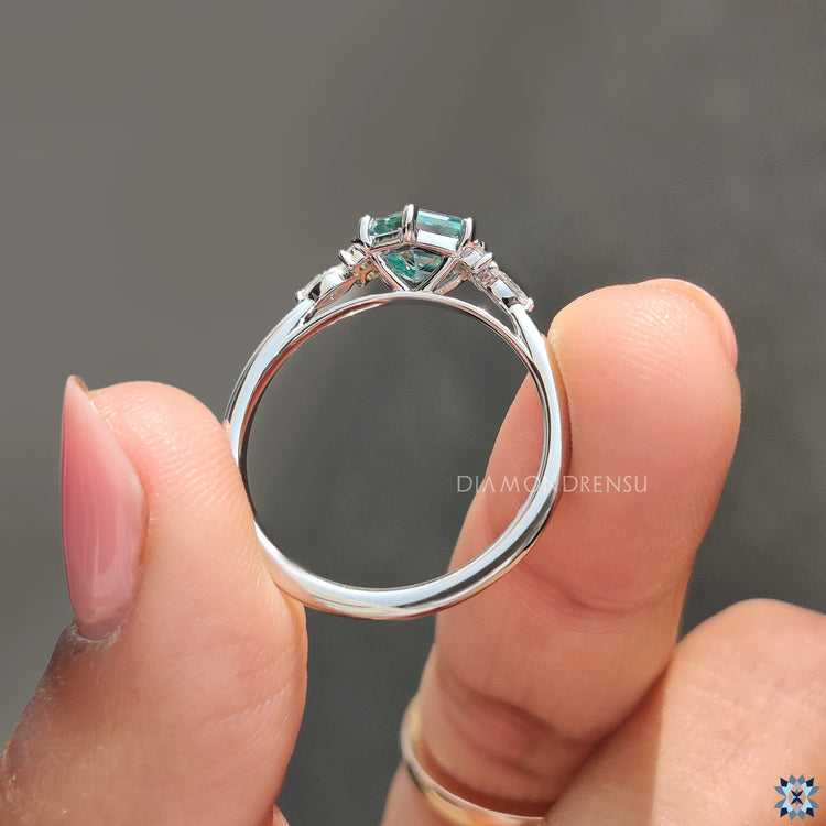 Cyan blue moissanite ring glows with bold and vivid colour.