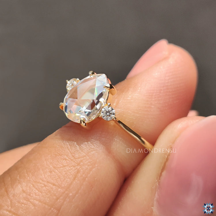 Handmade Ring featuring a unique 3 Stone Engagement design with pear rose cut diamonds.