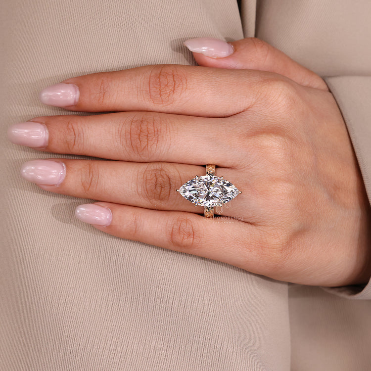 Diamondrensu AU ring with vintage hidden halo and marquise diamond.
