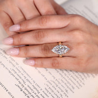 Hidden halo diamond ring with marquise centre.