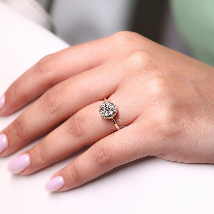 Round side stone in vintage engagement ring.