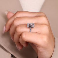 Custom diamond ring with emerald cut and pave band.