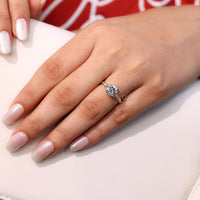 Round Cut Diamond Ring with bridge accent and 6 claw prong.