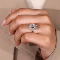 Custom diamond ring with oval cut and hidden halo design.