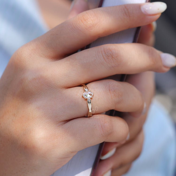 Twisted band with yellow gold engagement ring.