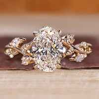 Oval diamond engagement ring with oval cluster diamond ring.