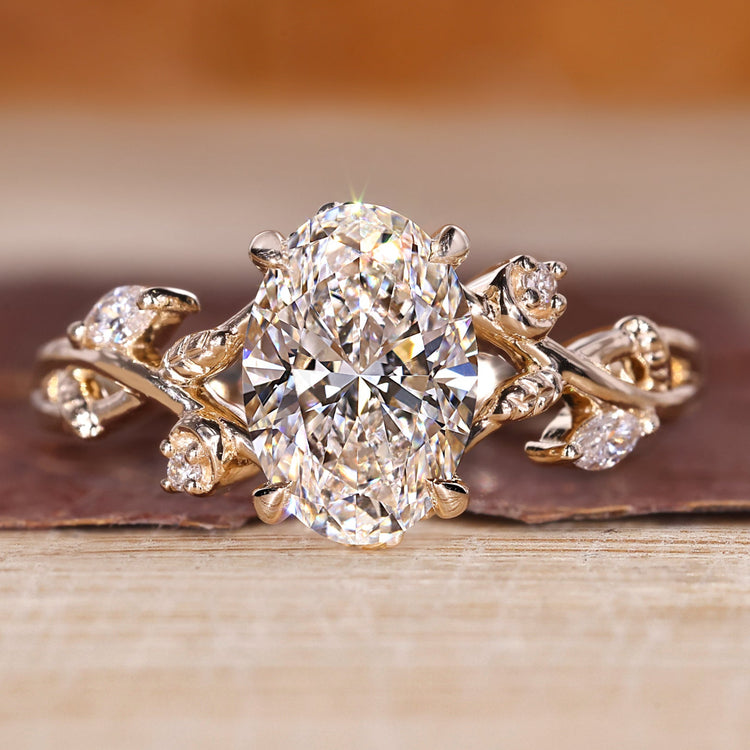 Oval diamond engagement ring with oval cluster diamond ring.