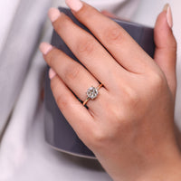 Round old cut diamond ring solitaire four prong style.