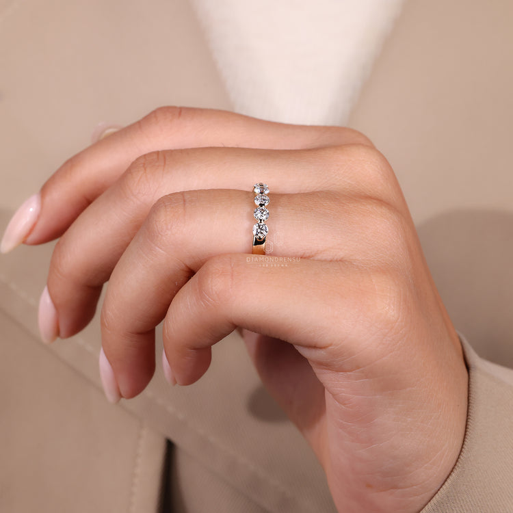 Shared prong setting round diamond band.