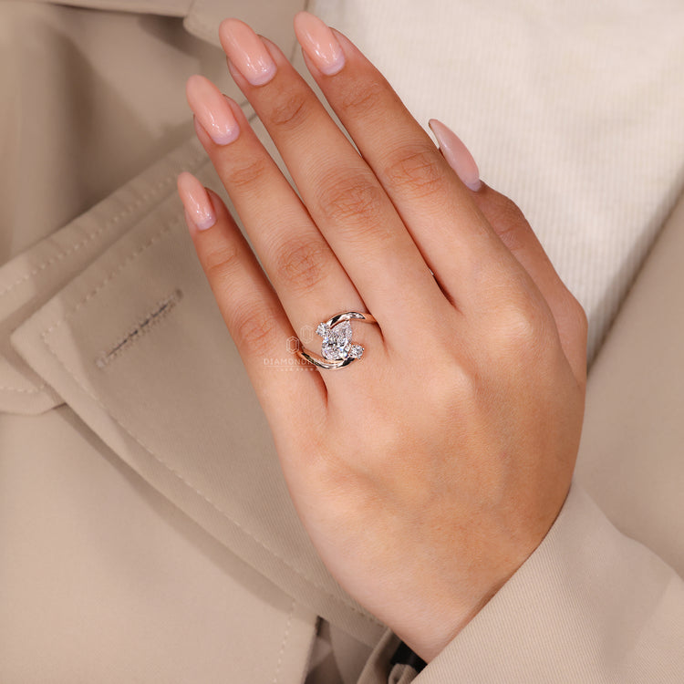 IGI certified pear and round diamond ring.