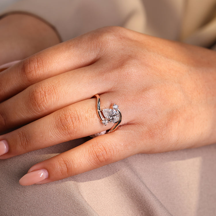 Rose gold ring with round side diamonds.