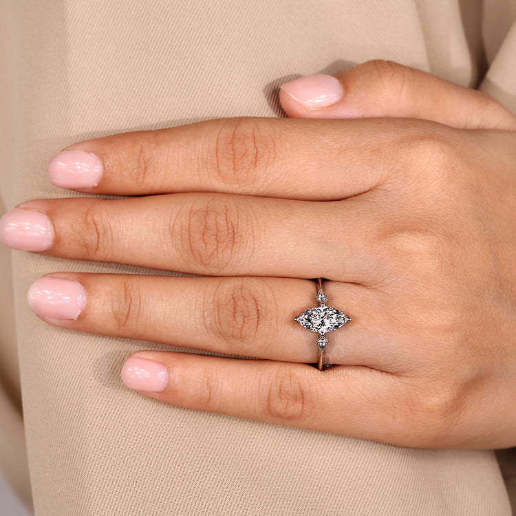 Handmade marquise diamond ring three stone style.