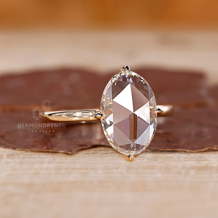 Solitaire oval rose diamond ring claw prong setting.