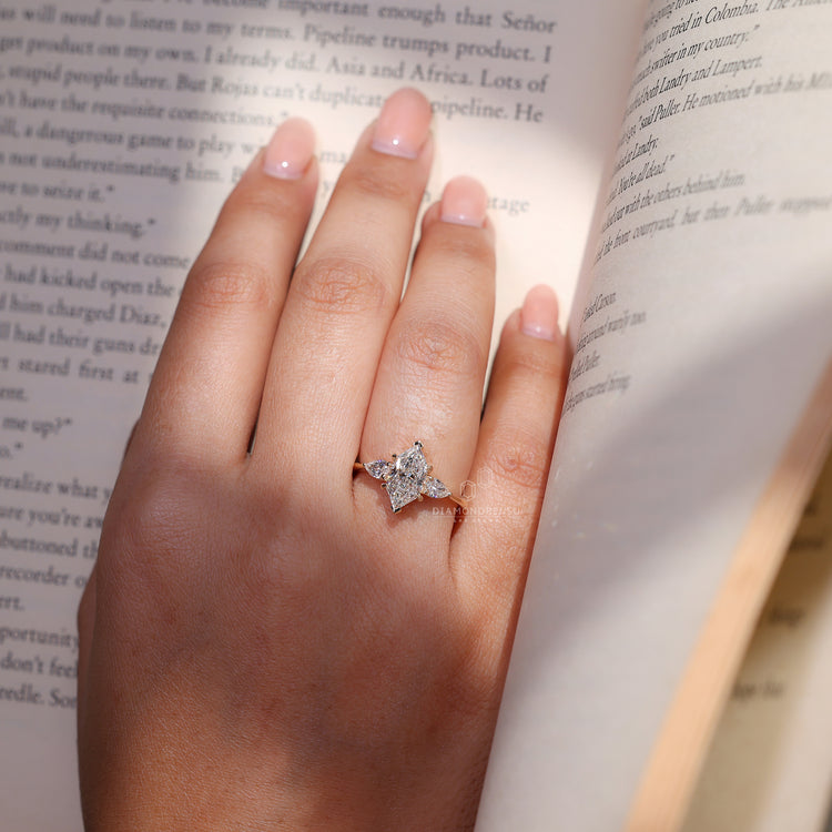 Dutch marquise ring three stone four claw prong set.