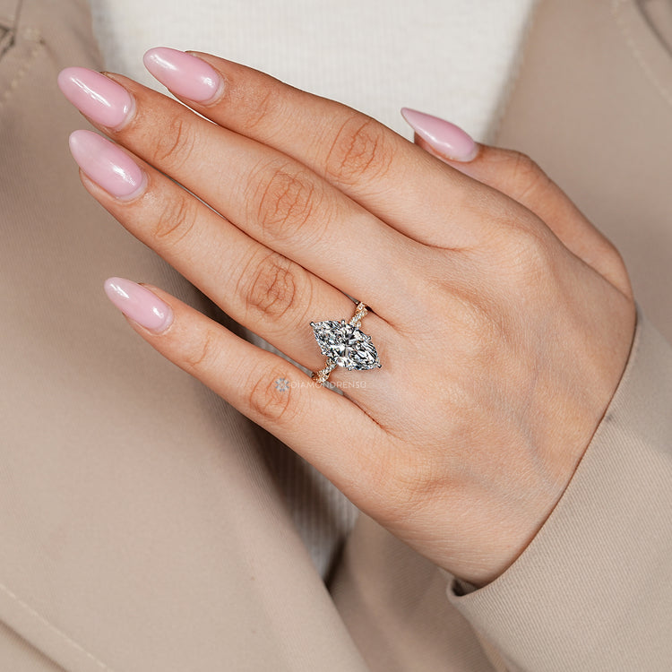 Marquise diamond ring with two tone setting.