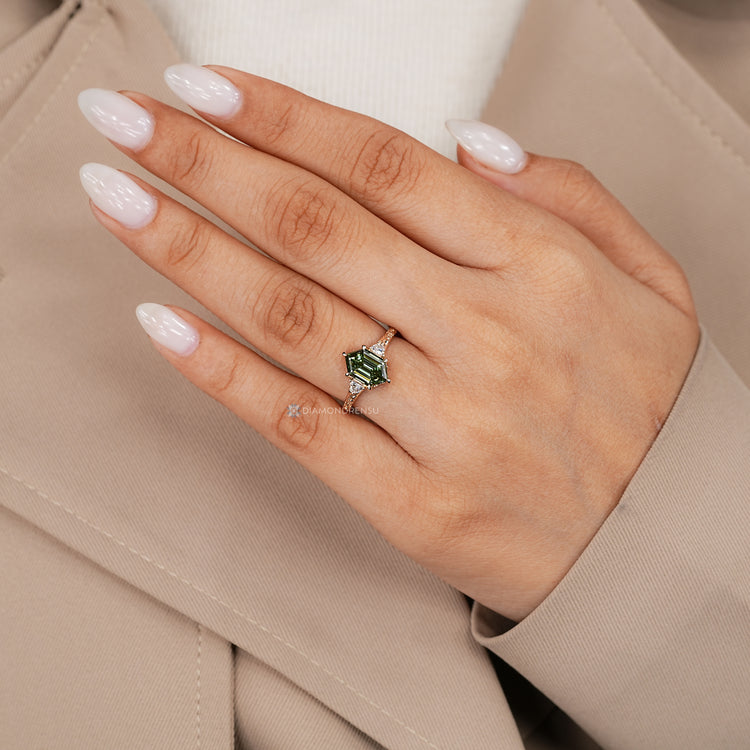 Art Deco hexagon ring with three stone design.