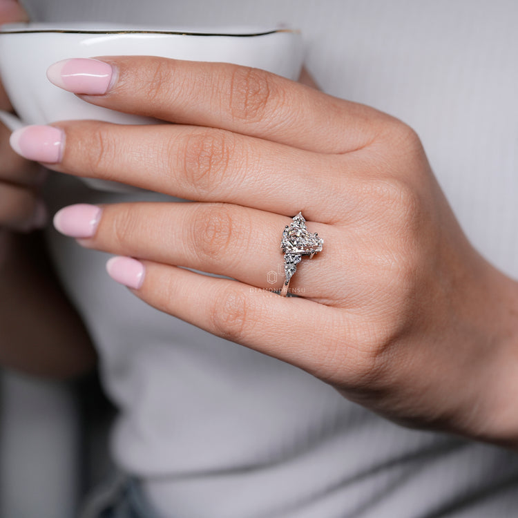 Coffin Cut Ring with Round Side Stones Prong Set.