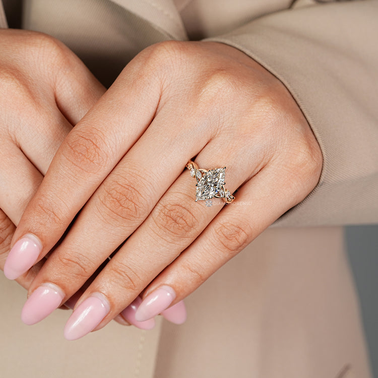 Marquise cut diamond ring with matching side stones.