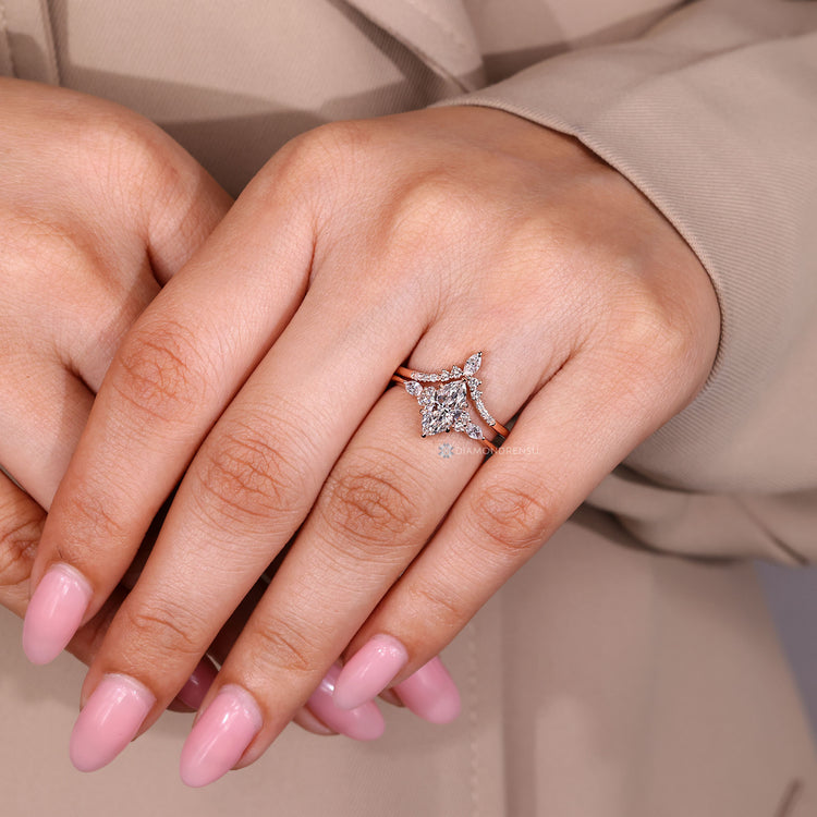 Handmade marquise diamond set with curved wedding band.