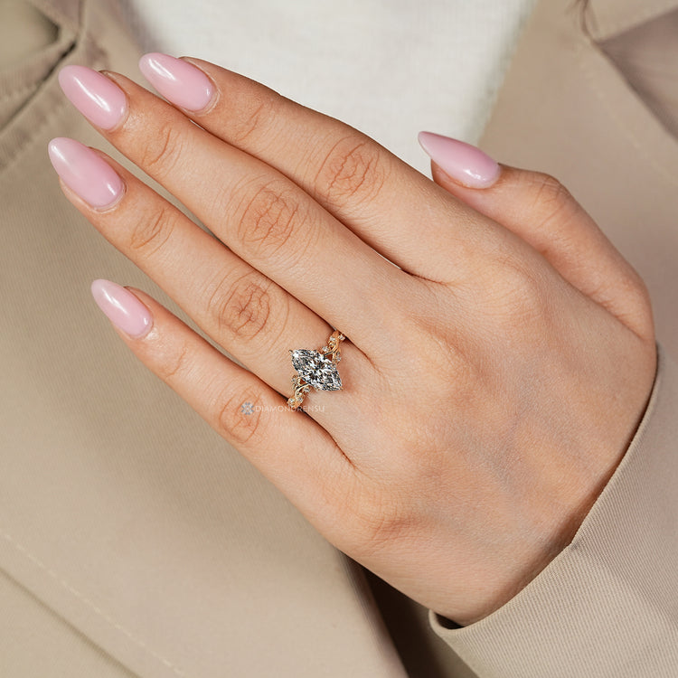 Handmade marquise diamond ring leaf prong design.
