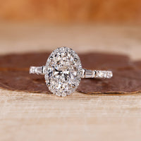 Oval shaped engagement ring with tapered baguette side stones.