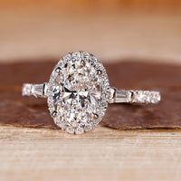 Oval shaped engagement ring with tapered baguette side stones.