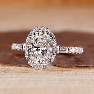 Oval shaped engagement ring with tapered baguette side stones.