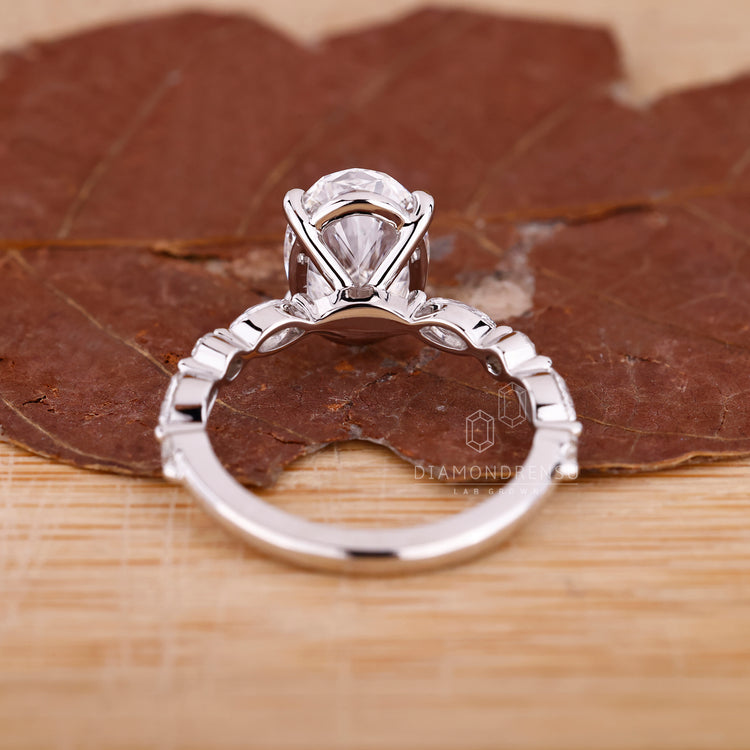 Lab Grown Diamond in marquise and round side stone.