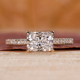 Radiant engagement ring with east to west setting.