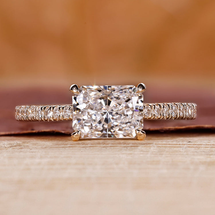 Radiant engagement ring with east to west setting.