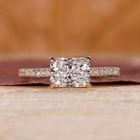 Radiant engagement ring with east to west setting.