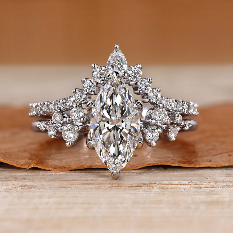 Marquise diamond bridal set with round side stones.