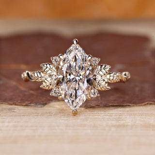Marquise cut diamond ring with nature inspired design.