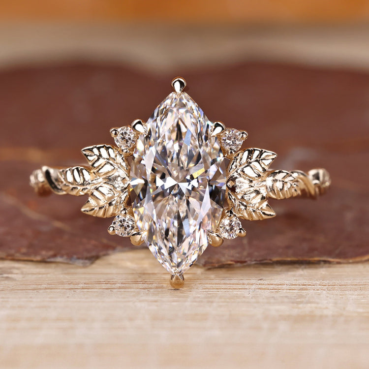 Marquise cut diamond ring with nature inspired design.