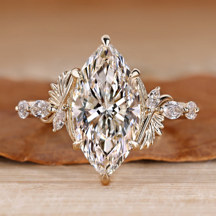 Marquise cut diamond ring shared prong pave style