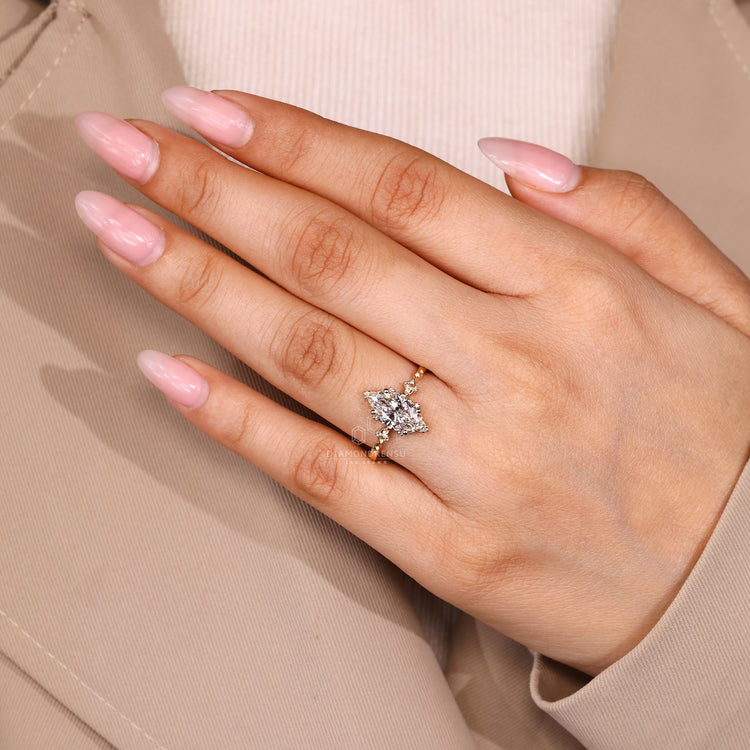 Marquise diamond ring four prong setting style.