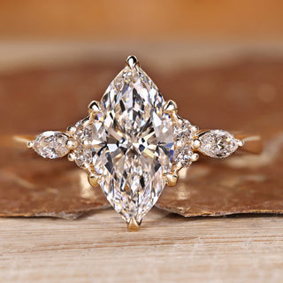 Marquise diamond ring with marquise and round side stones.