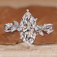 Marquise cut diamond ring hidden halo style.