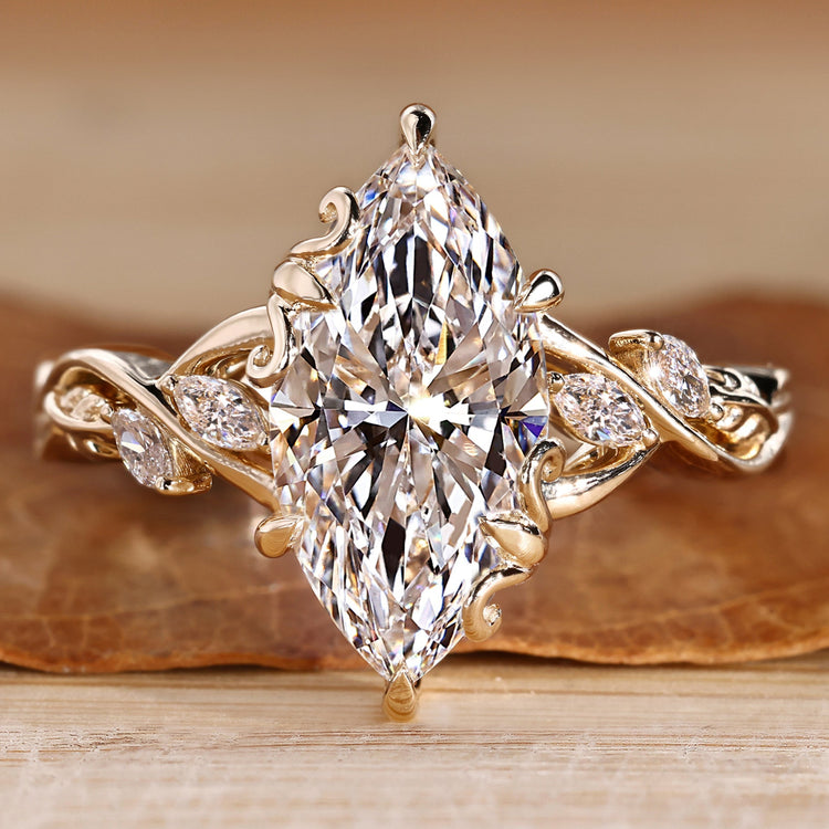 Marquise cut diamond ring with marquise side stones.