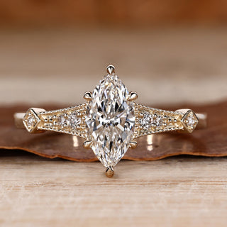 Marquise cut diamond ring vintage round side stones.