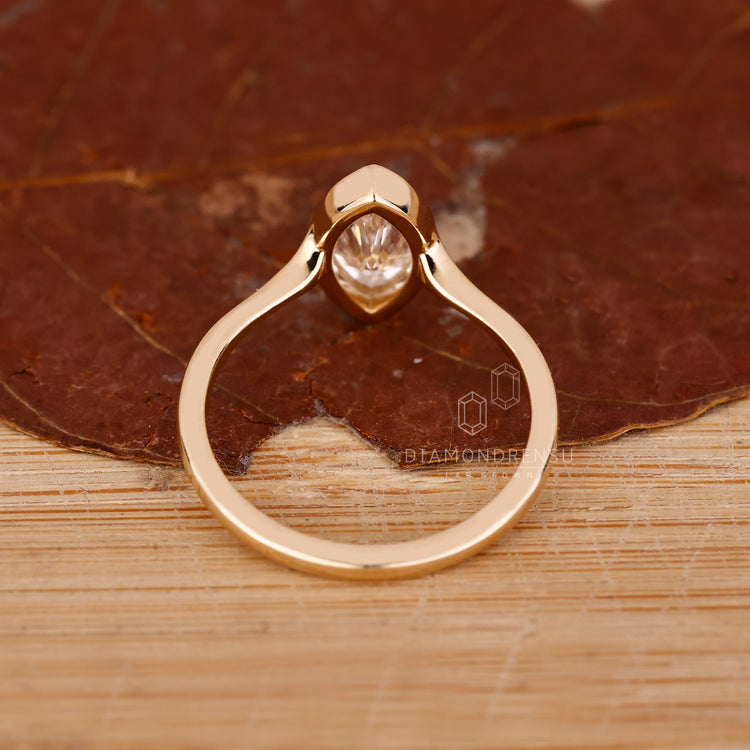 IGI certified marquise diamond ring bezel solitaire set.