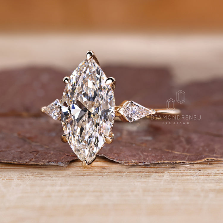 Six claw prong setting marquise engagement ring.