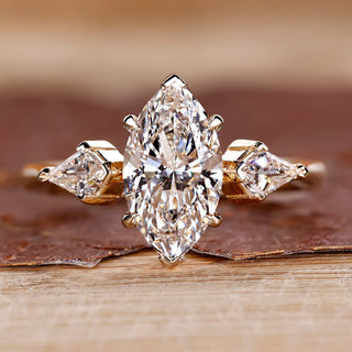 Three stone diamond ring with marquise centre stone.