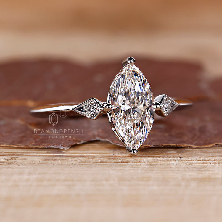 Three stone marquise diamond ring compass prong set.