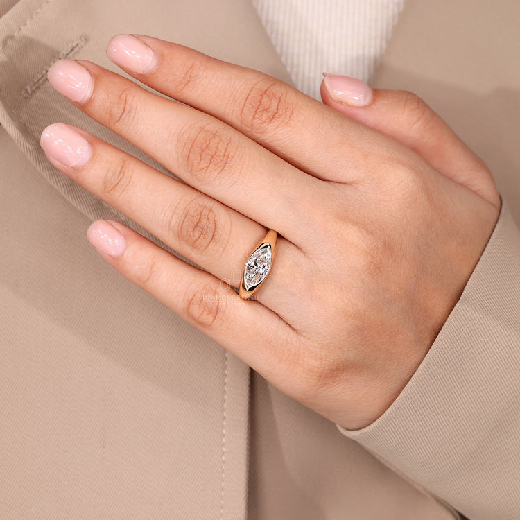 Elegant flush marquise diamond engagement ring.